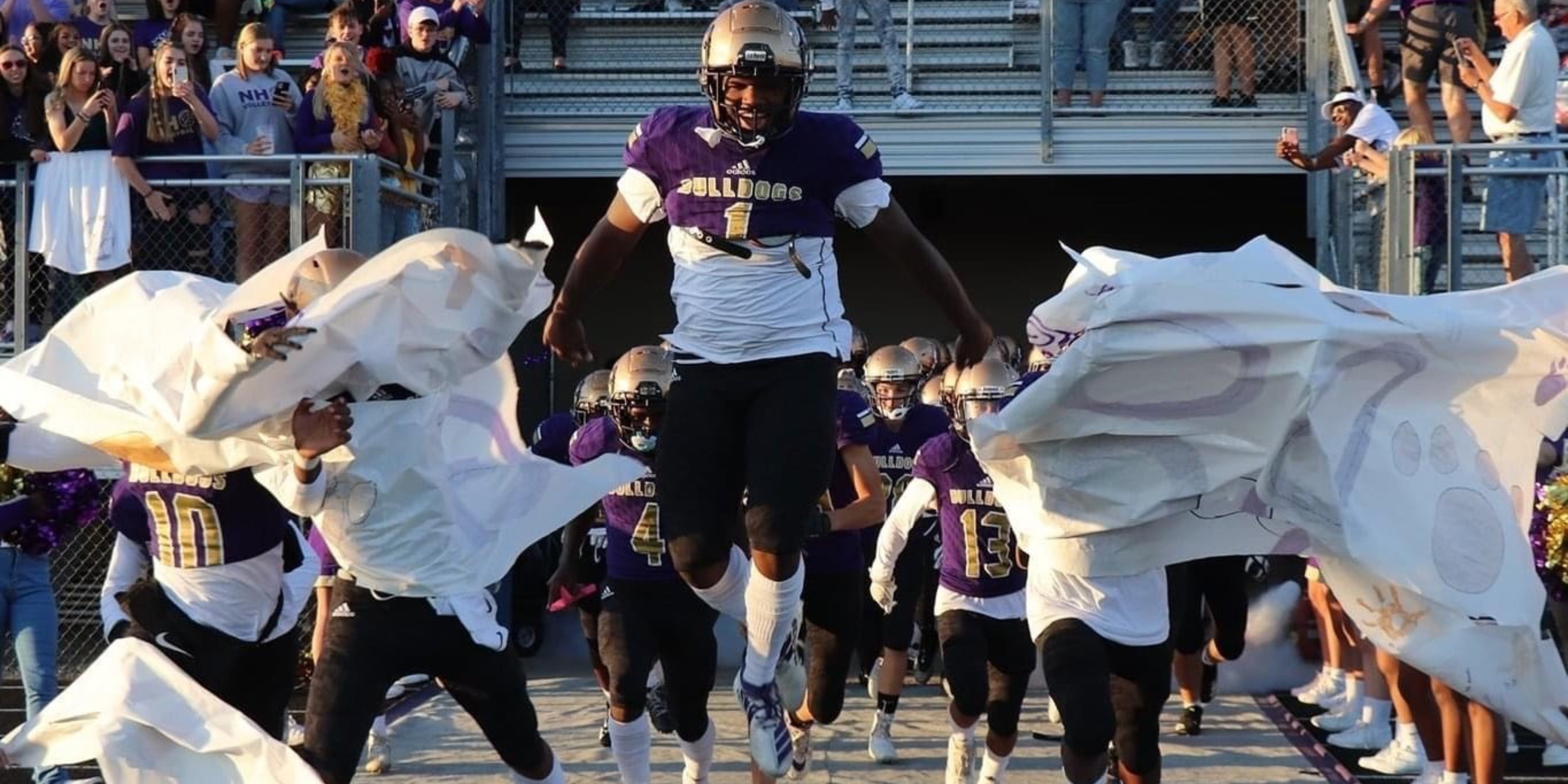 New Haven Highschool football team making entrance onto football field