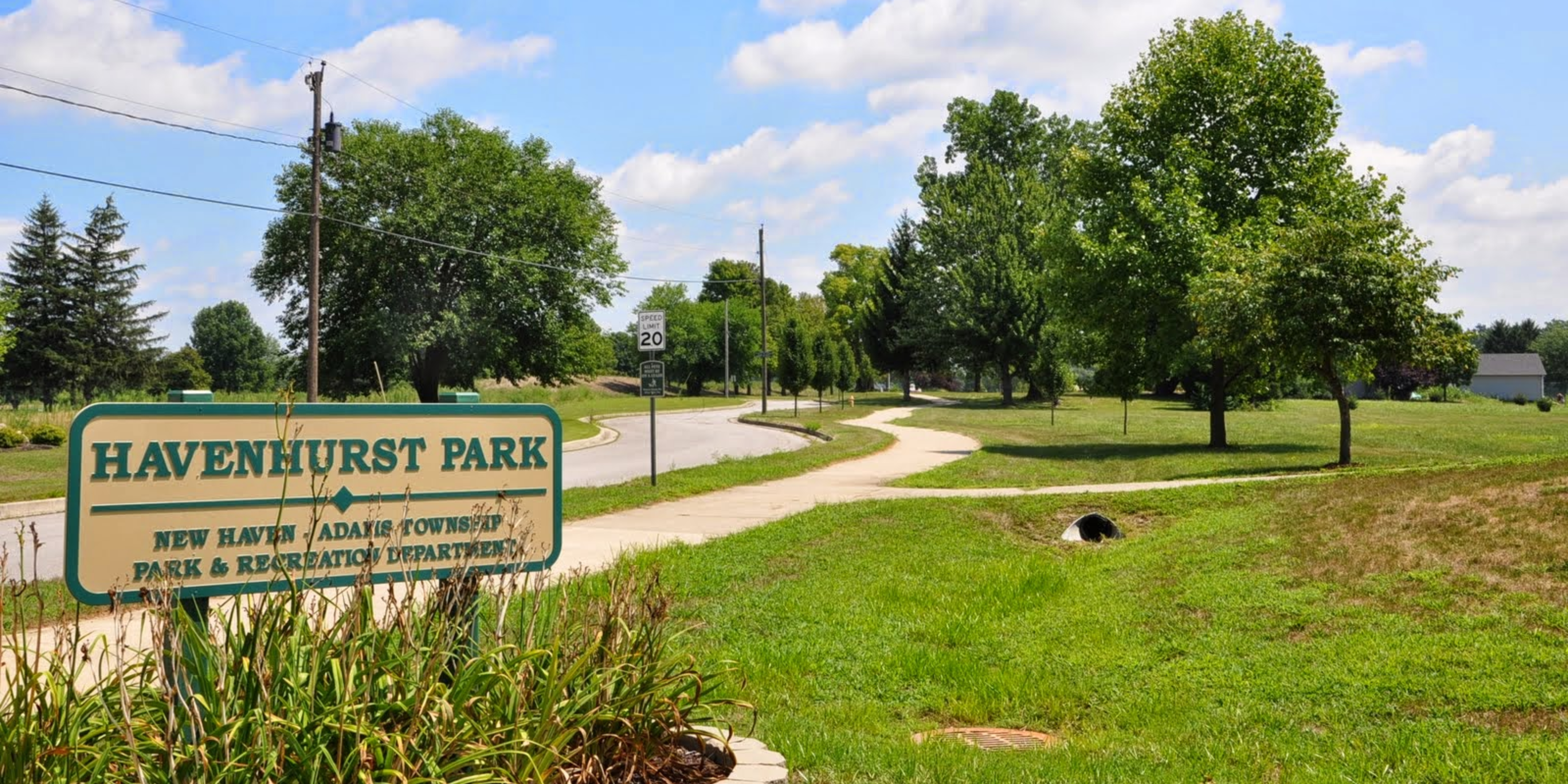 Havenhurst Park Entrance Sign with Park in Background