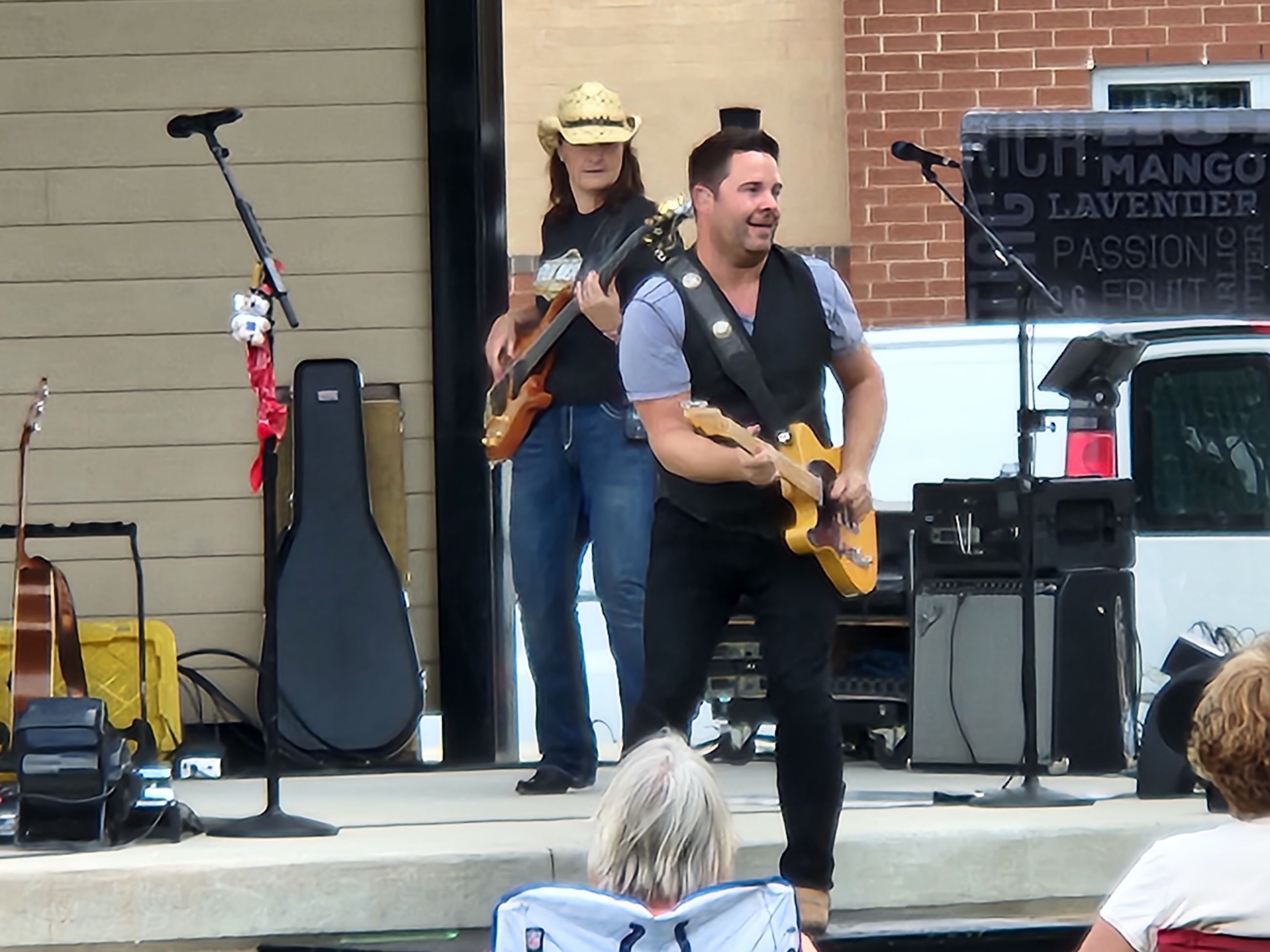 Hubie Ashcraft playing guitar on stage at the M3 event