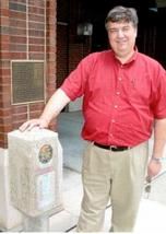 Section 3 - 4.7 - Mayor McDonald posing by Lincoln Concrete marker